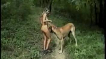 Slim beauty enjoys filthy pleasure with a huge canine