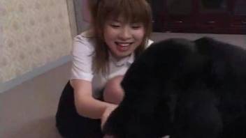 Asian girl enjoys nasty dog bestiality in the bedroom