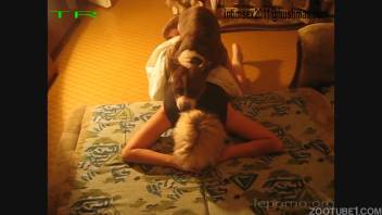 Seasoned blond woman attempts intimacy with sturdy animal companion in the bedroom