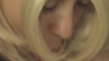 Blonde slut gives head to a dog on live cam