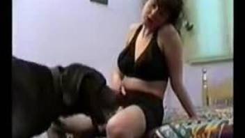 Woman in black lingerie tries sex with a dog