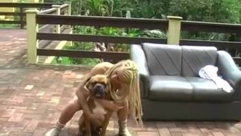 Blonde vixen taking it hard in the rear from a canine