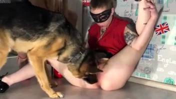 Stunning masked woman on a leash and collar in bestiality session