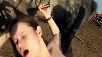 Hot babe screwed by her man while blowing a horse cock