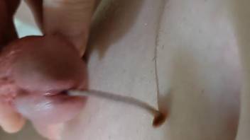 Man inserts large worms into his dick for extra sloppy masturbation