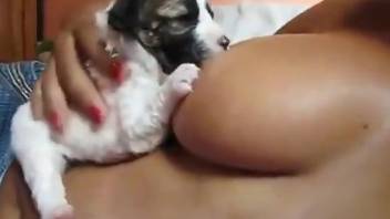 Sexy female leaves her furry little puppy suck on her tits